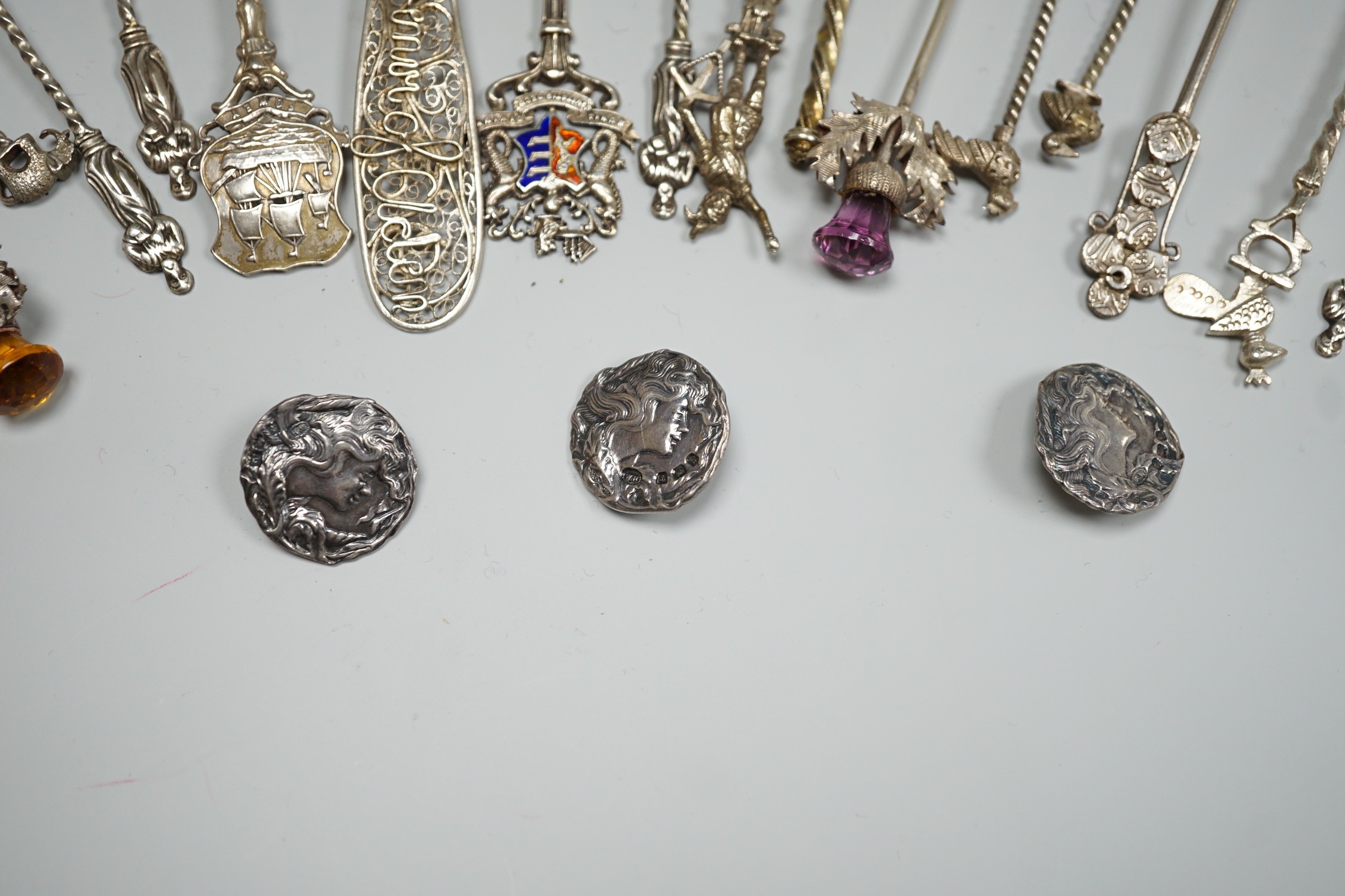 A collection of small silver and white metal spoons and forks including commemorative and three Art Nouveau silver buttons, Birmingham, 1901.